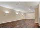 Large unfinished basement with recessed lights, sconces and wood floors offers great flexibility at 7637 Sand Run Ct, Indianapolis, IN 46259