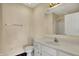 Bathroom with a single sink vanity, framed mirror, towel rack, and a white toilet at 7637 Sand Run Ct, Indianapolis, IN 46259