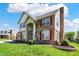 Two-story house featuring brick, shutters and a well-manicured front lawn at 7637 Sand Run Ct, Indianapolis, IN 46259