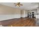 Open-concept layout with living room leading into a modern kitchen featuring white cabinets and stainless appliances at 7637 Sand Run Ct, Indianapolis, IN 46259