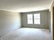Inviting bedroom space with two windows, neutral walls, and ready for customization at 792 Oakleaf Dr, Greenfield, IN 46140