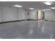 Large, bright basement space with emergency exit door and multiple closets at 809 S Harrison St, Alexandria, IN 46001