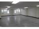 Spacious basement area with multiple windows, plain walls, and fluorescent lighting at 809 S Harrison St, Alexandria, IN 46001