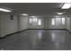 Open basement area with neutral walls, bright lighting, and door to the outside at 809 S Harrison St, Alexandria, IN 46001