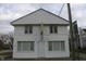 Symmetrical two-story commercial building with white siding under a cloudy sky at 809 S Harrison St, Alexandria, IN 46001