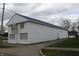 Two story commercial building features a metal roof, siding and signage at 809 S Harrison St, Alexandria, IN 46001