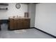 Small kitchenette area with dark wood cabinets and minimal appliances at 809 S Harrison St, Alexandria, IN 46001