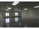 The large multipurpose room has smooth floors, recessed lights, and window views to the outside at 809 S Harrison St, Alexandria, IN 46001