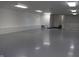 Spacious multipurpose room with sleek floors, featuring lighting and stairwell access at 809 S Harrison St, Alexandria, IN 46001