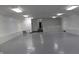 Spacious multipurpose room with sleek floors, featuring recessed lights and stairwell access at 809 S Harrison St, Alexandria, IN 46001