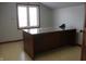 Office with a large glass top desk in front of window with light wood floors at 809 S Harrison St, Alexandria, IN 46001