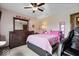 Cozy bedroom featuring a comfortable bed and a dresser, providing a peaceful retreat at 8180 E County Road 400 N, Brownsburg, IN 46112