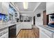 Updated kitchen with stainless steel appliances, granite counters, and backyard view at 8180 E County Road 400 N, Brownsburg, IN 46112