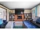 Relaxing living room showcasing a fireplace, plush couches, and an inviting atmosphere at 8180 E County Road 400 N, Brownsburg, IN 46112
