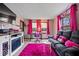 Cozy living room featuring an electric fireplace, a comfortable sofa, and vibrant pink accents at 8180 E County Road 400 N, Brownsburg, IN 46112