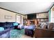 Spacious living area displaying comfortable furniture, a cozy fireplace and ample room for entertaining at 8180 E County Road 400 N, Brownsburg, IN 46112