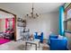 Bright living room with stylish blue furniture and a chic bar area, perfect for entertaining at 8180 E County Road 400 N, Brownsburg, IN 46112