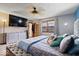 Inviting bedroom featuring a large bed, soft lighting, and ample storage for comfortable living at 8180 E County Road 400 N, Brownsburg, IN 46112