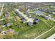 Aerial view of the community displaying the pond, streetscape, and the layout of homes at 8452 Ironhill Ct, Indianapolis, IN 46259