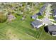 Bird's-eye view of a charming home featuring a neatly manicured lawn and mature trees at 8452 Ironhill Ct, Indianapolis, IN 46259