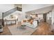 Open-concept living space with staircase, a cozy living room with sofa, and a bright kitchen with an island and bar seating at 8452 Ironhill Ct, Indianapolis, IN 46259