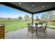 Outdoor patio with a dining table and chairs overlooking a big, green lawn at 8452 Ironhill Ct, Indianapolis, IN 46259