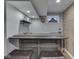 Basement bar features a wooden counter, two stools, a brick wall, and a shelf at 8926 New Heritage Ct, Indianapolis, IN 46239