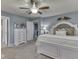 Bedroom boasting a bed, dresser, and well-lit entry to a walk-in closet, offering ample storage at 8926 New Heritage Ct, Indianapolis, IN 46239