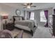Bedroom with plush seating area bathed in light from window, complimented by rich colored accents at 8926 New Heritage Ct, Indianapolis, IN 46239
