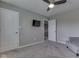 Bedroom featuring a ceiling fan, a television, and an adjacent doorway at 8926 New Heritage Ct, Indianapolis, IN 46239