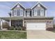 Inviting two-story home with blue siding, brick accents, and a well-manicured front yard at 8926 New Heritage Ct, Indianapolis, IN 46239