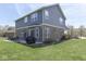 Back exterior view of the two-story home with patio at 8926 New Heritage Ct, Indianapolis, IN 46239