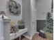 Inviting foyer with decorative wreath, bench seating, and unique decor to welcome guests at 8926 New Heritage Ct, Indianapolis, IN 46239