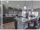 Modern kitchen featuring a center island, dark cabinetry, and stainless steel appliances at 8926 New Heritage Ct, Indianapolis, IN 46239