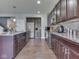 Functional kitchen with granite countertops, stainless steel appliances, and ample cabinet storage at 8926 New Heritage Ct, Indianapolis, IN 46239