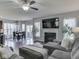 Open-concept living room flows into the dining area, perfect for modern living and entertaining at 8926 New Heritage Ct, Indianapolis, IN 46239