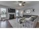Inviting living room with a cozy fireplace, plush sofa, and stylish decor for comfortable living at 8926 New Heritage Ct, Indianapolis, IN 46239