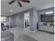 Cozy upstairs loft with comfortable seating, neutral colors, and a ceiling fan at 8926 New Heritage Ct, Indianapolis, IN 46239