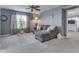 Relaxing loft space featuring a comfortable sectional sofa, soft carpet, and large windows at 8926 New Heritage Ct, Indianapolis, IN 46239