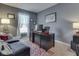 Functional office space with a large desk, comfortable seating, and tasteful decor at 8926 New Heritage Ct, Indianapolis, IN 46239