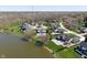 Aerial view of homes in a lakeside community with many homes featuring pools at 1016 Silver Lake Ct, Greenwood, IN 46142