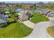 Expansive home with a three-car garage, lush green yard and a lovely view of the lake at 1016 Silver Lake Ct, Greenwood, IN 46142