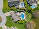 Aerial view of a spacious home with a swimming pool, patio and expansive, well-manicured yard at 1016 Silver Lake Ct, Greenwood, IN 46142