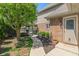 Well-manicured backyard featuring a pool and brick patio with a walkway to a side entrance at 1016 Silver Lake Ct, Greenwood, IN 46142