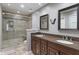 Elegant bathroom featuring double sinks, granite countertops, and a glass-enclosed shower at 1016 Silver Lake Ct, Greenwood, IN 46142