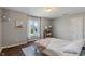 Inviting bedroom with hardwood floors and a bright window for natural light at 1016 Silver Lake Ct, Greenwood, IN 46142