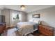 Relaxing bedroom boasts hardwood floors, a neutral palette, and natural light at 1016 Silver Lake Ct, Greenwood, IN 46142