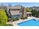 A stunning brick home with a swimming pool, covered patio and a beautifully landscaped yard at 1016 Silver Lake Ct, Greenwood, IN 46142