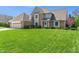 Inviting home with manicured lawn, brick exterior, and a well-kept two-car garage at 1016 Silver Lake Ct, Greenwood, IN 46142