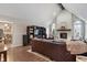 Spacious living room with vaulted ceiling, fireplace, and comfortable leather seating at 1016 Silver Lake Ct, Greenwood, IN 46142
